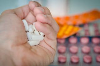 Canva – White Oval Medication Tablets in Hand Canva - White Oval Medication Tablets in Hand